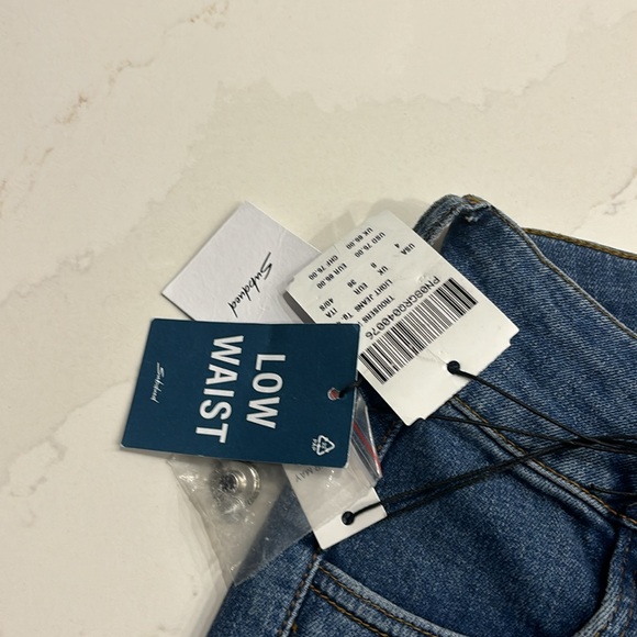 Subdued Low Waist Flare Jean With Front Square Pockets - Picture 9 of 13